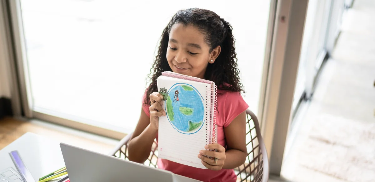 Student showing a draw to her online class