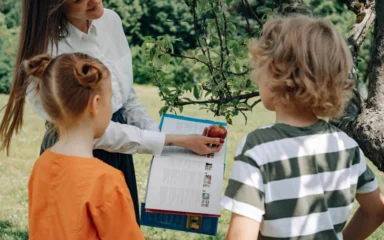 A boy and a girl studying trees