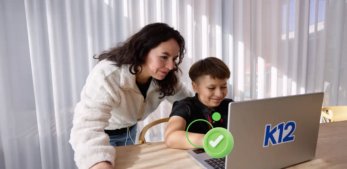 Mother and son working with their laptop